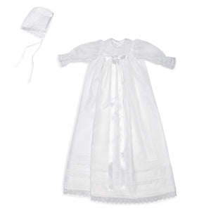 White organza baptismal and christening gown with lace and matching bonnet.